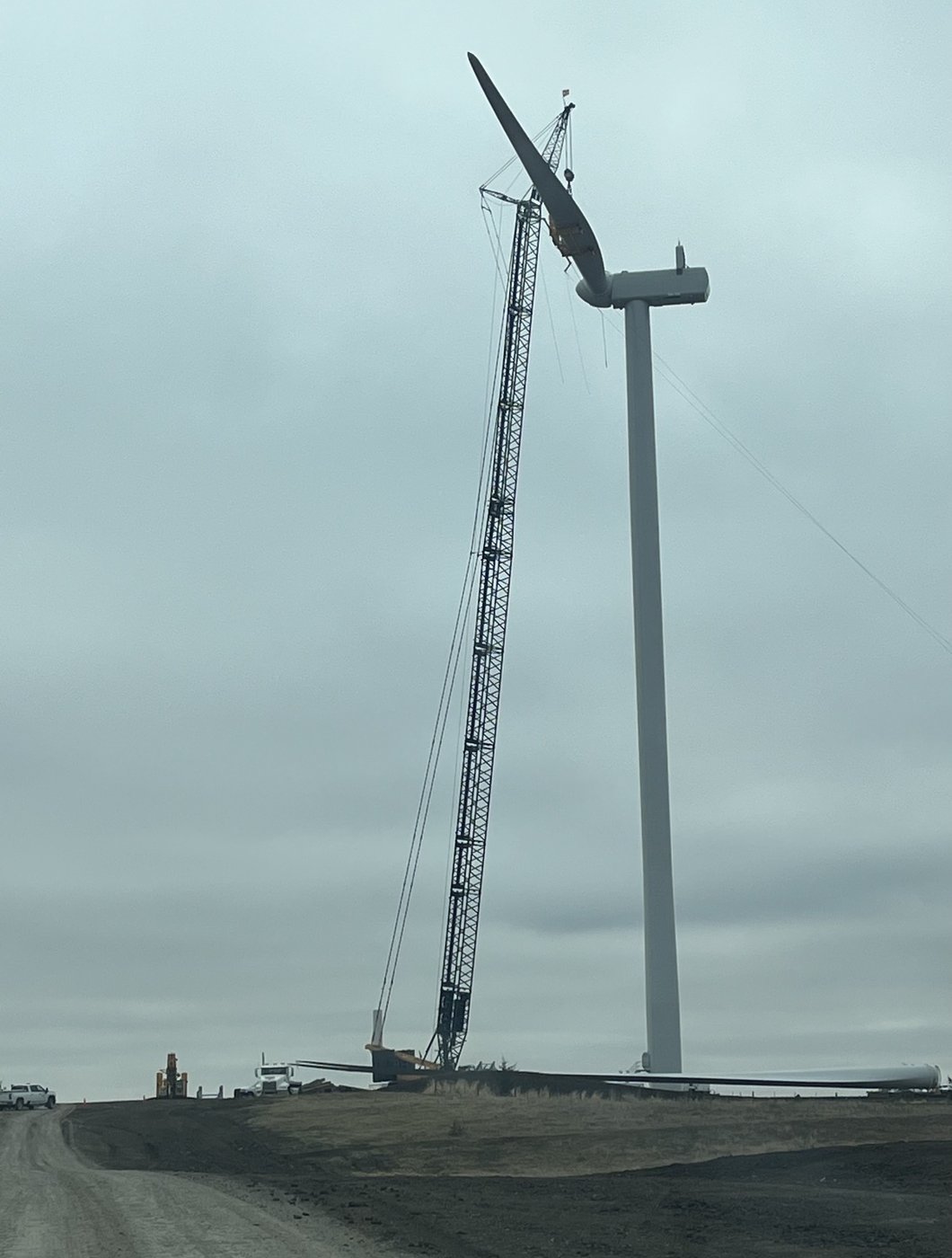 Lattice boom crane lifting a wind turbine blade